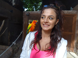 Yara with a small parrot in Marineland, Palma de Mallorca